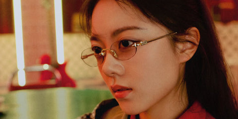 Chinese actress Zhao Jinmai was seen wearing gold Miu Miu MU 53WV 5AK1O1 rimless oval optical glasses in the Miu Miu Eyewear Spring 2025 campaign.