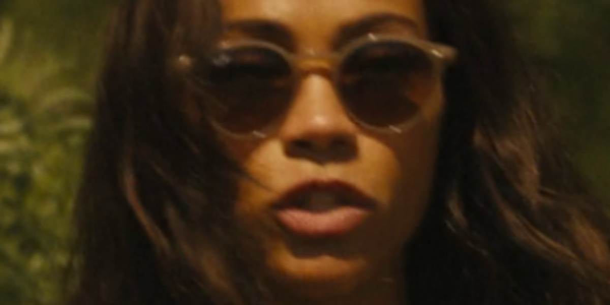 Zoe Saldana wears Ray-Ban RB 2180 6166/13 Round sunglasses while filming Special Ops: Lioness