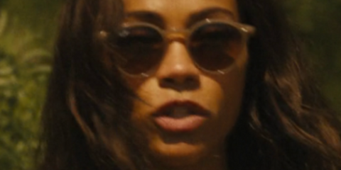 Zoe Saldana wears Ray-Ban RB 2180 6166/13 Round sunglasses while filming Special Ops: Lioness