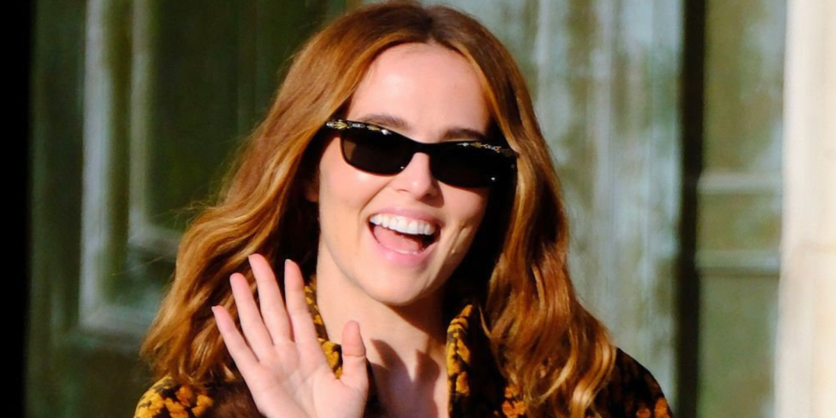 Zoey Deutch wore black Valentino La Coureuse VG0044S 001 sunglasses at the Valentino Spring Summer 2027 show during Paris Fashion Week.