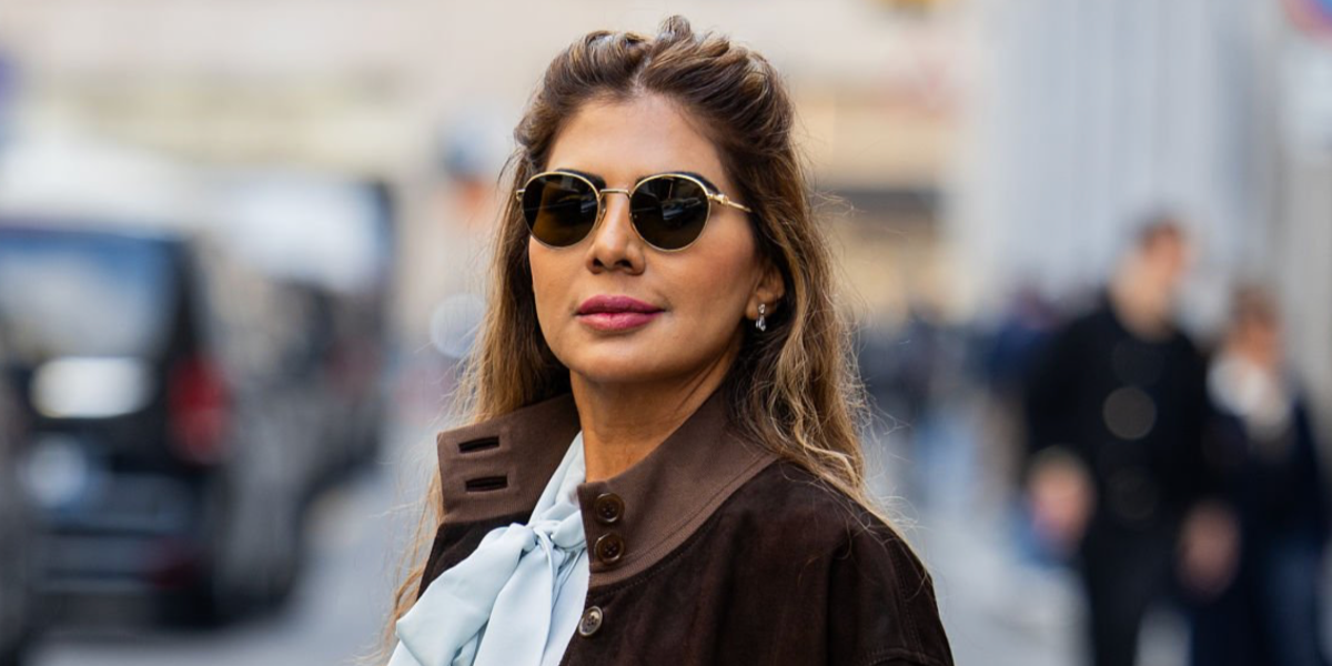 Dubai-based influencer and accessories designer Zufi Alexander was seen wearing gold Miu Miu MU 55ZS 5AK09Z round sunglasses during Milan Fashion Week season Fall/Winter 2026.