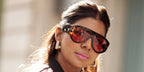 Dubai-based influencer and accessories designer Zufi Alexander was seen wearing tortoiseshell Tom Ford Bronson TF1044 52S sunglasses with red lenses during Paris Fashion Week season Spring/Summer 2026.